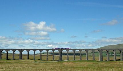 A train crosses Ribblehead Viaduct in North Yorkshire